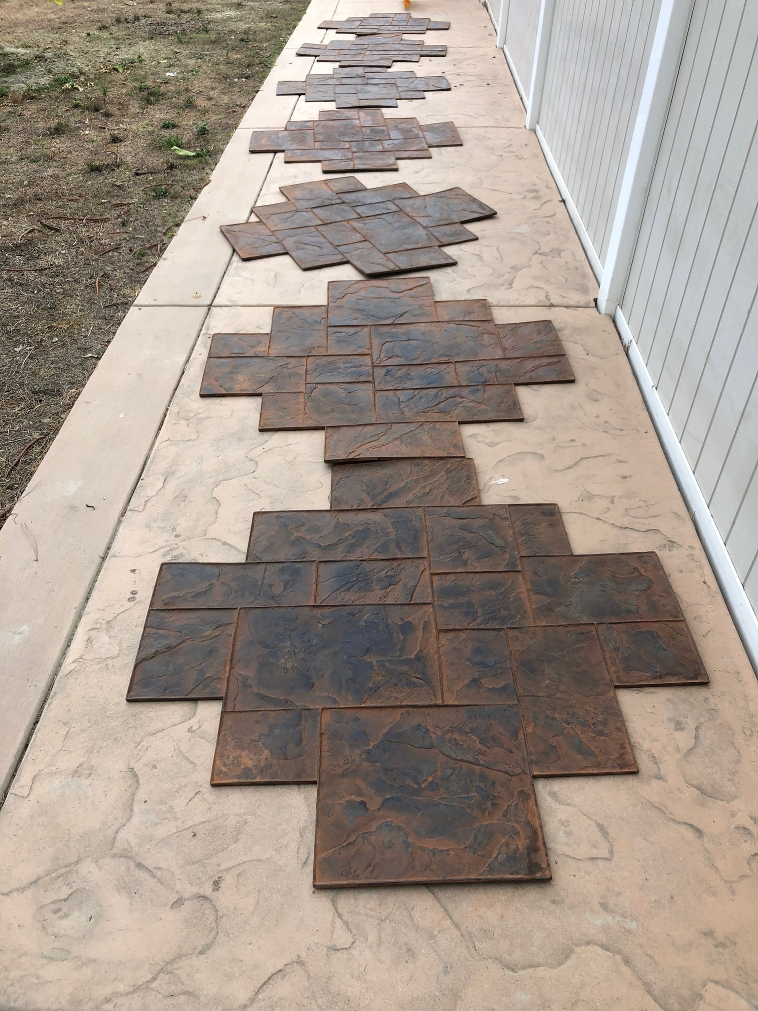 Stamped concrete molds showing aggregate texture